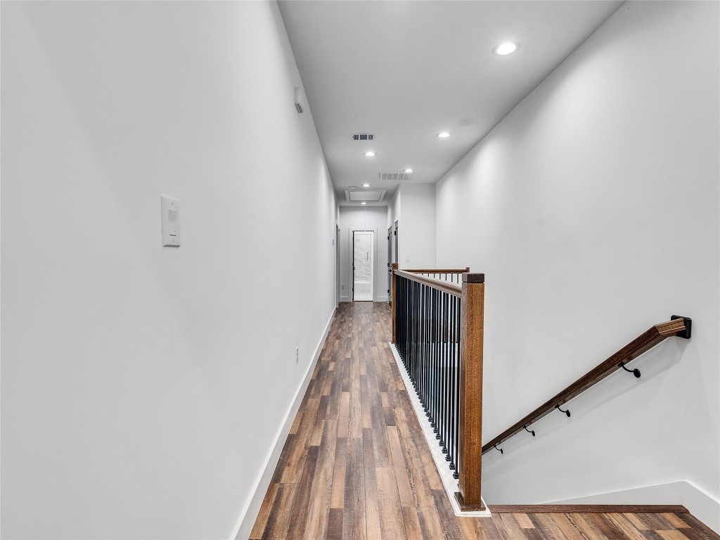 237 Hahlo Street Houston, TX 77020 - Photo 14 of 23 a view of a hallway with wooden floor