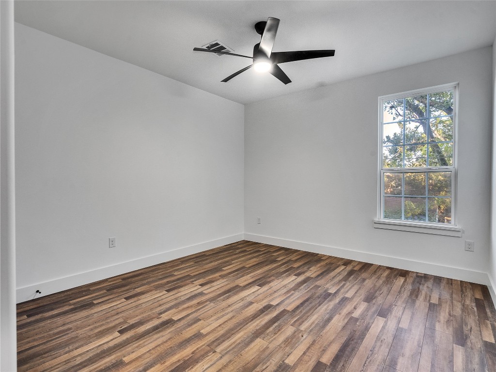 237 Hahlo Street Houston, TX 77020 - Photo 15 of 23 a view of empty room with wooden floor and fan