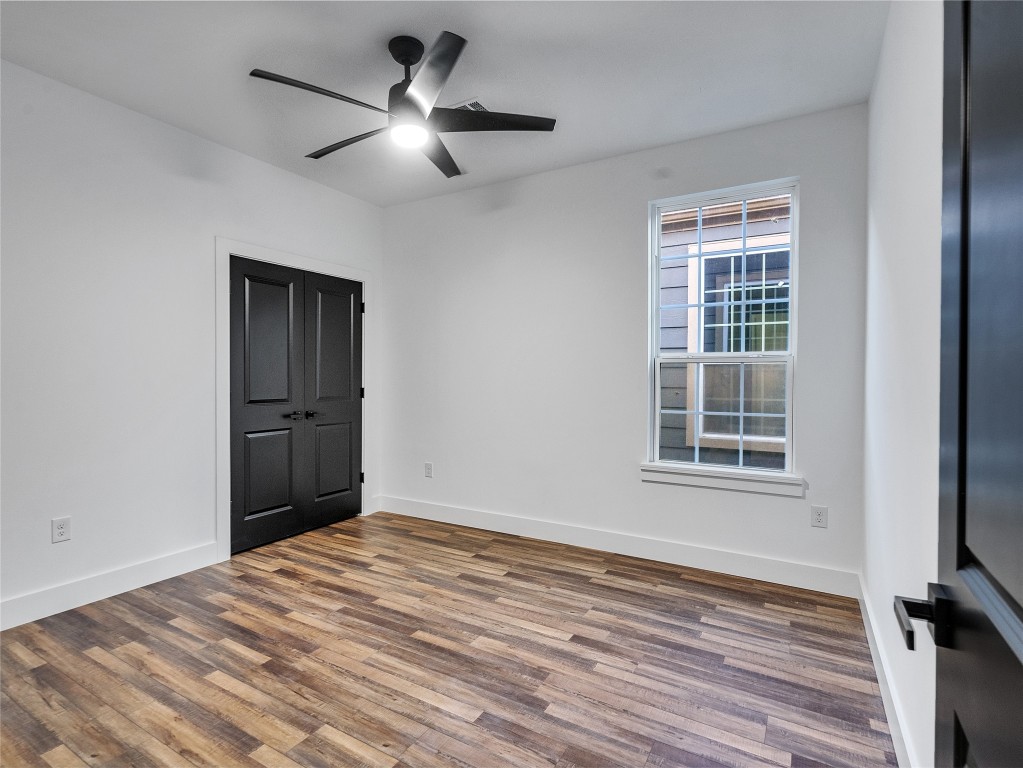 237 Hahlo Street Houston, TX 77020 - Photo 16 of 23 a view of empty room with wooden floor and fan