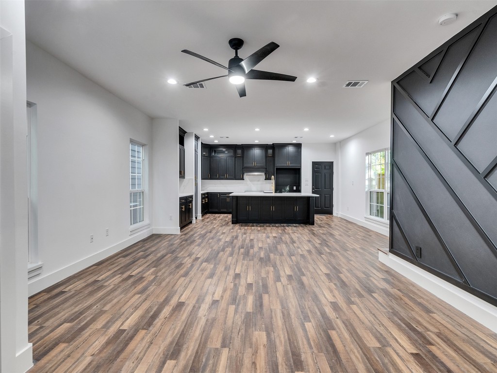 237 Hahlo Street Houston, TX 77020 - Photo 2 of 23 a view of kitchen and hall with wooden floor