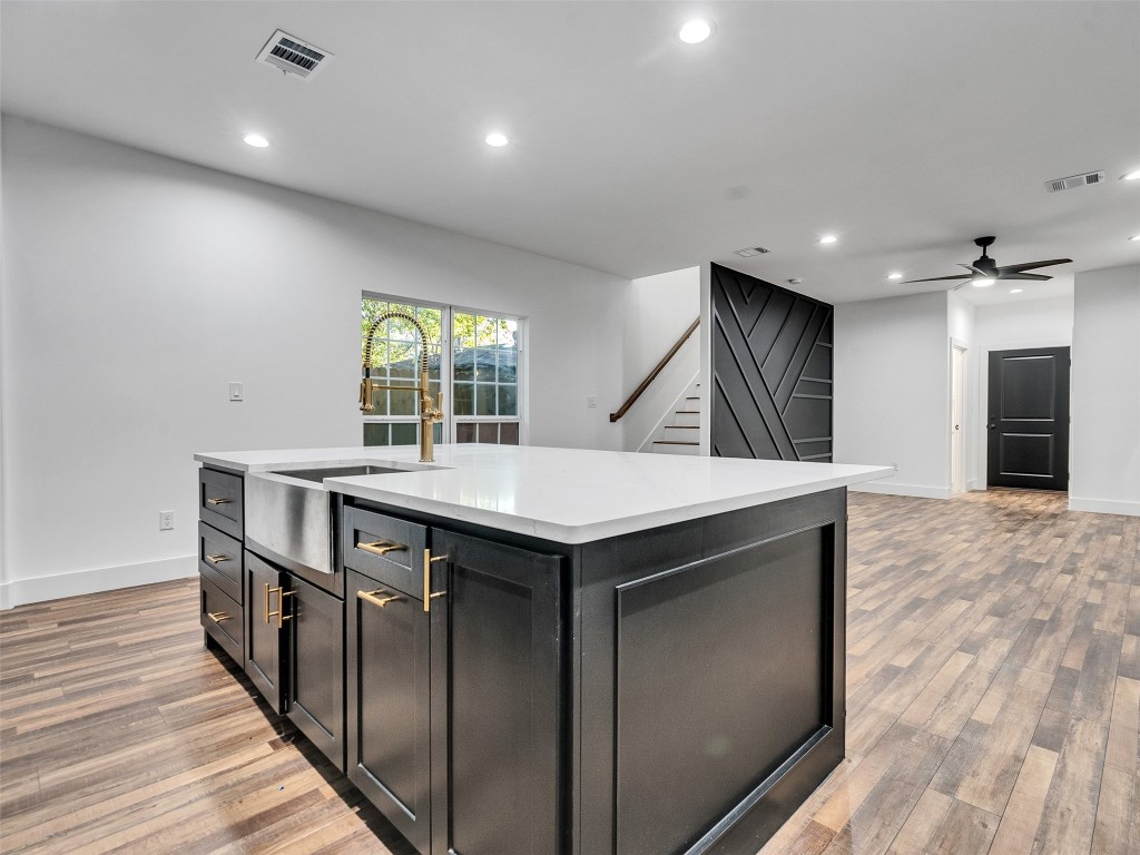 237 Hahlo Street Houston, TX 77020 - Photo 4 of 23 an empty room with wooden floor and windows