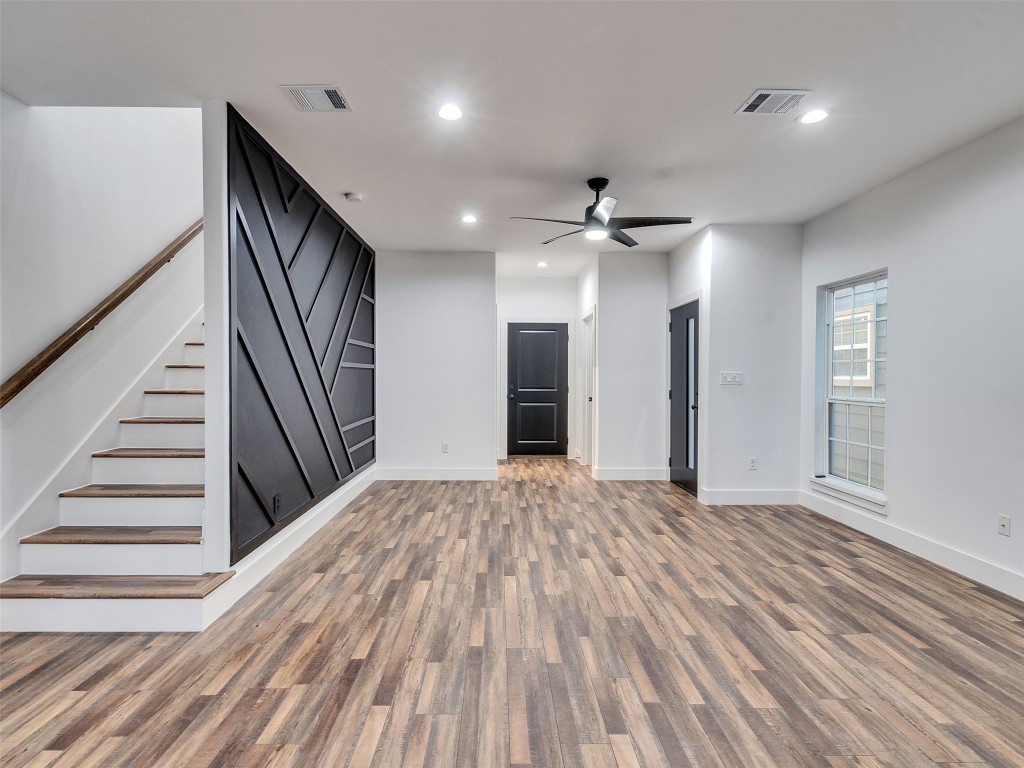 237 Hahlo Street Houston, TX 77020 - Photo 8 of 23 wooden floor in an empty room with a mirror