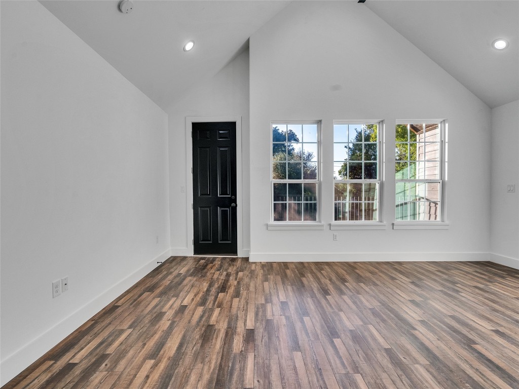 237 Hahlo Street Houston, TX 77020 - Photo 9 of 23 an empty room with wooden floor and windows