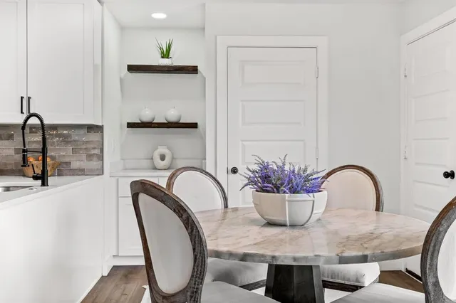 a dining room with furniture and window