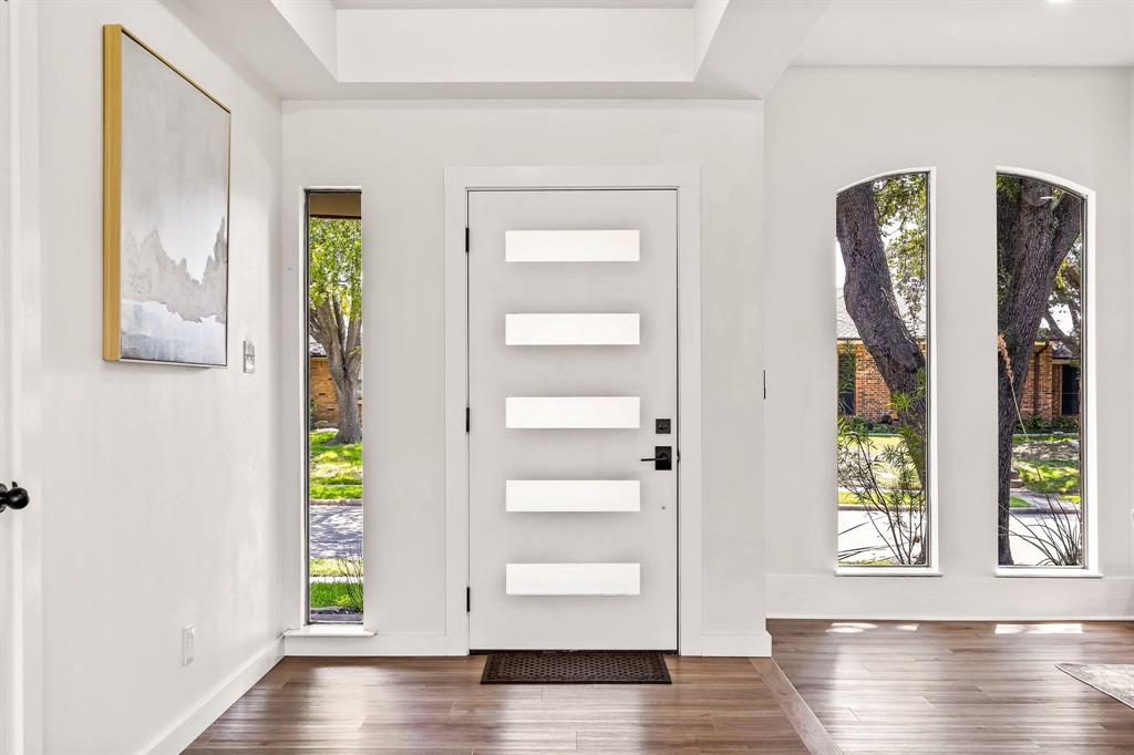 2205 Timberwood Carrollton, TX 75006 - Photo 2 of 32 a view of an entryway with wooden floor