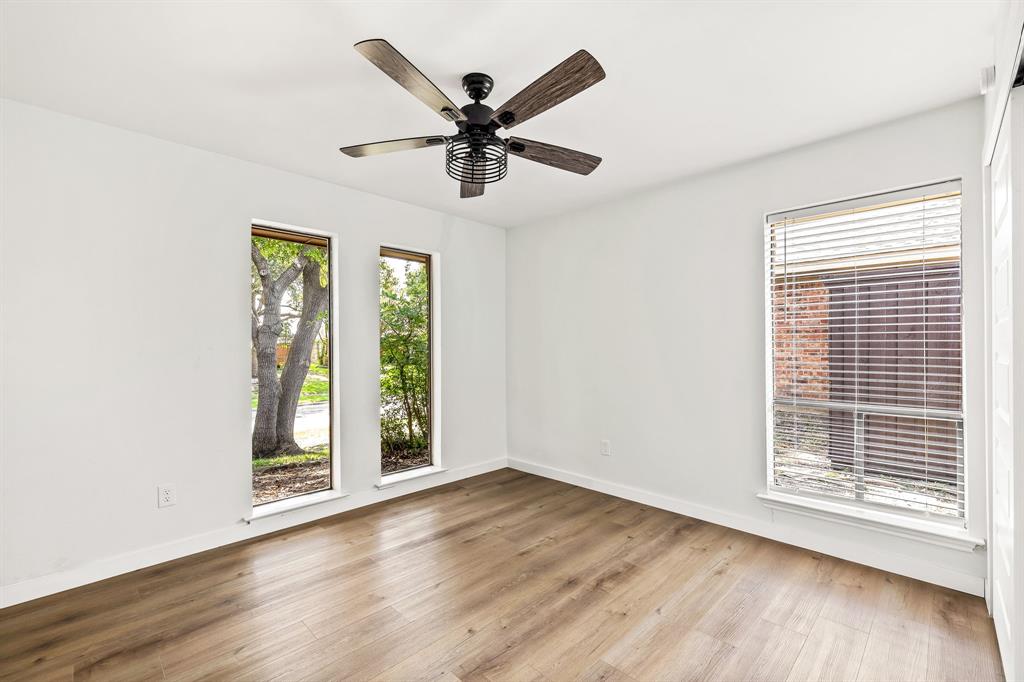2205 Timberwood Carrollton, TX 75006 - Photo 23 of 32 a view of an empty room with wooden floor and a window