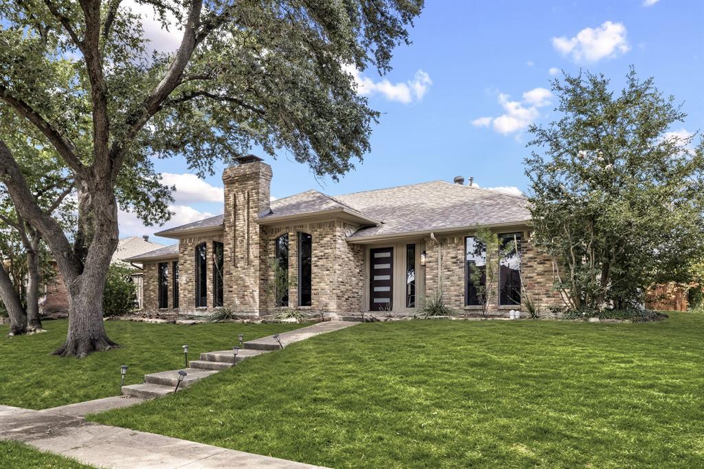 2205 Timberwood Carrollton, TX 75006 - Photo 28 of 32 front view of a house with a yard