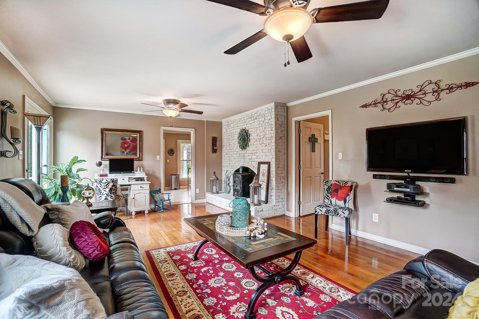2803 Trinity Church Road Monroe, NC 28112 - Photo 11 of 48 a living room with furniture and a flat screen tv