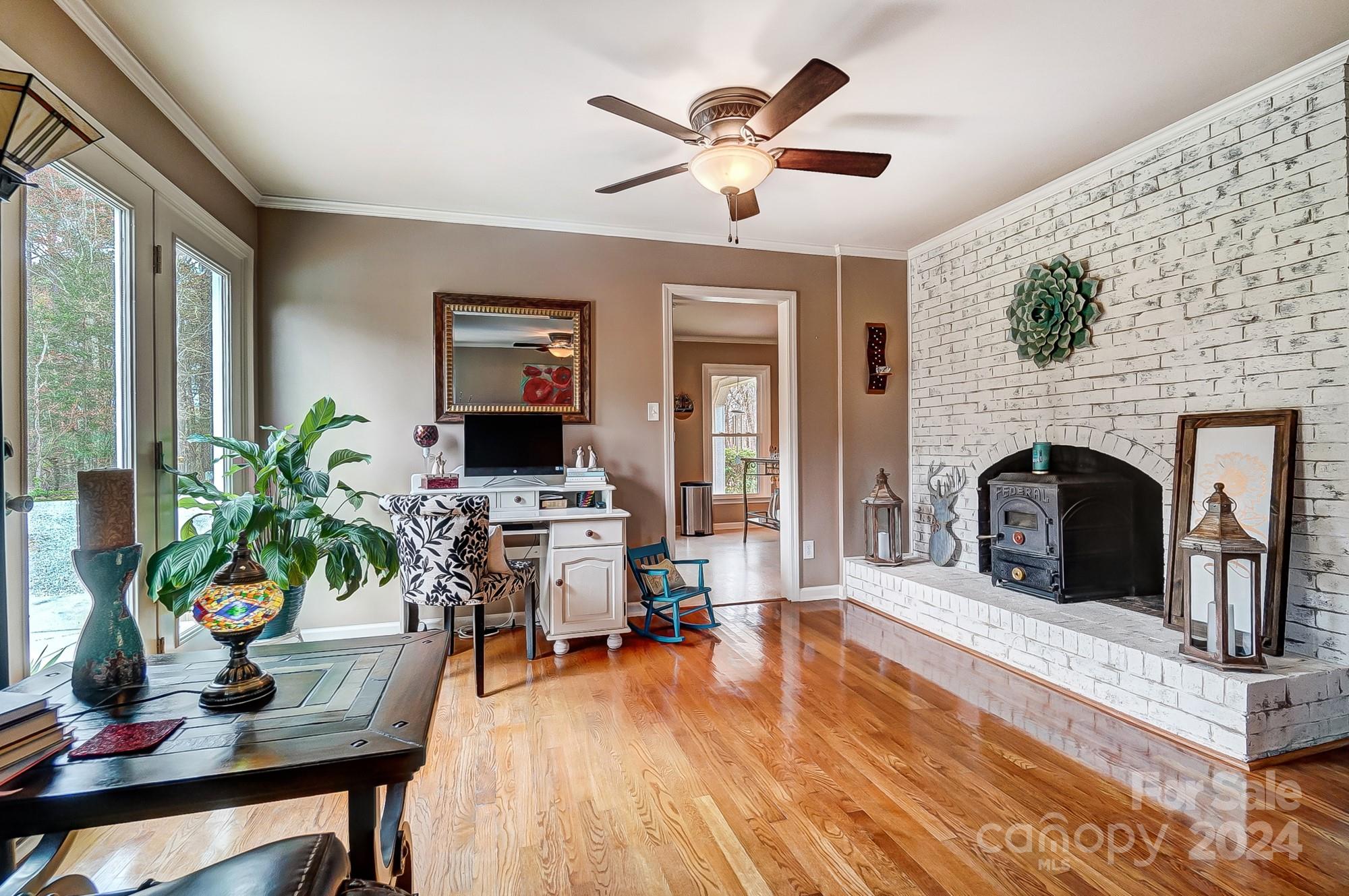 2803 Trinity Church Road Monroe, NC 28112 - Photo 12 of 48 a living room with furniture and a fireplace