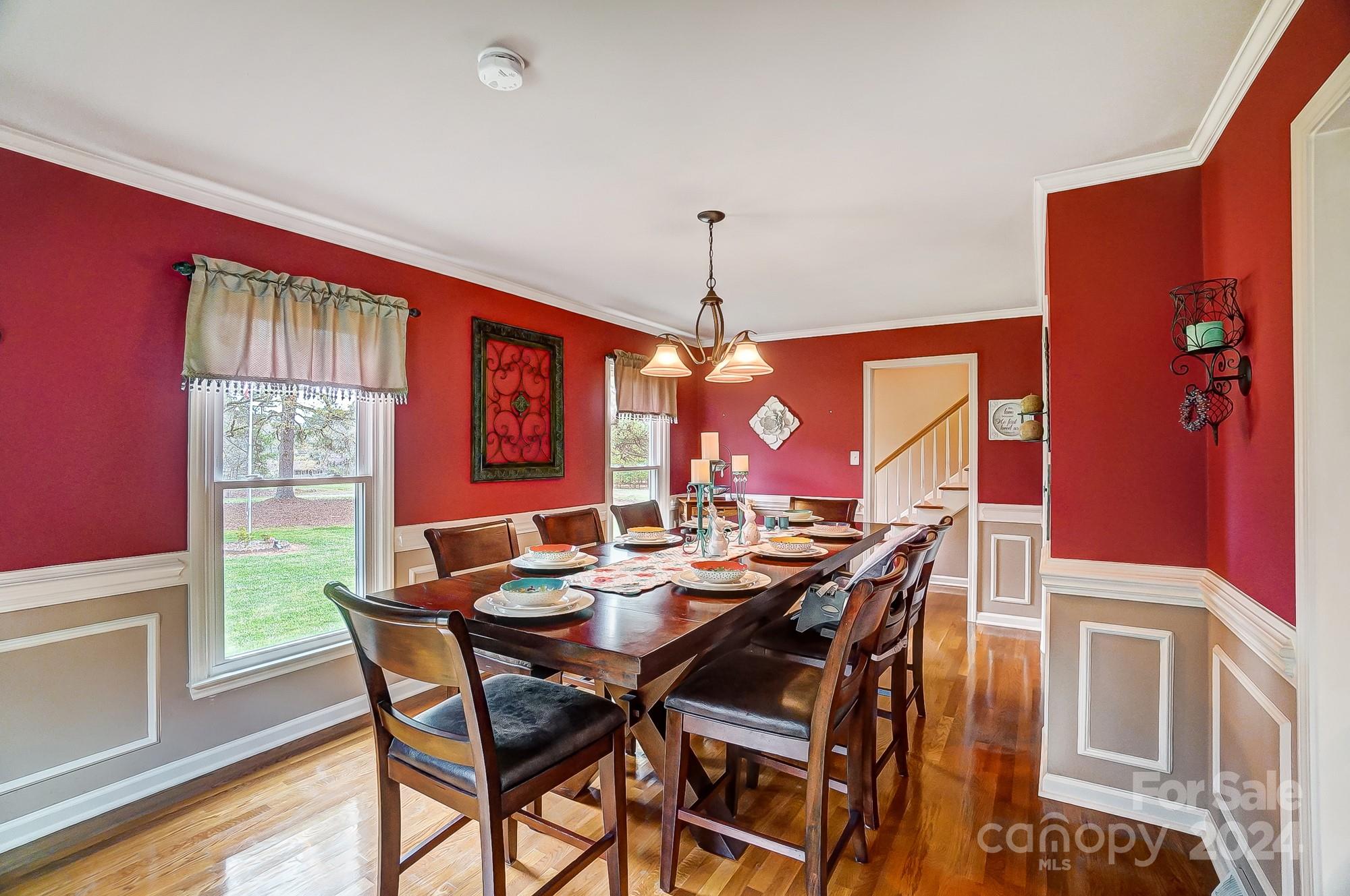 2803 Trinity Church Road Monroe, NC 28112 - Photo 17 of 48 a view of a dining room with furniture and chandelier