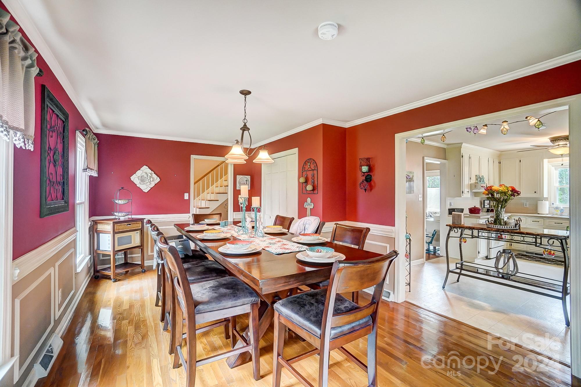 2803 Trinity Church Road Monroe, NC 28112 - Photo 18 of 48 a view of a dining room with furniture one side kitchen view and wooden floor