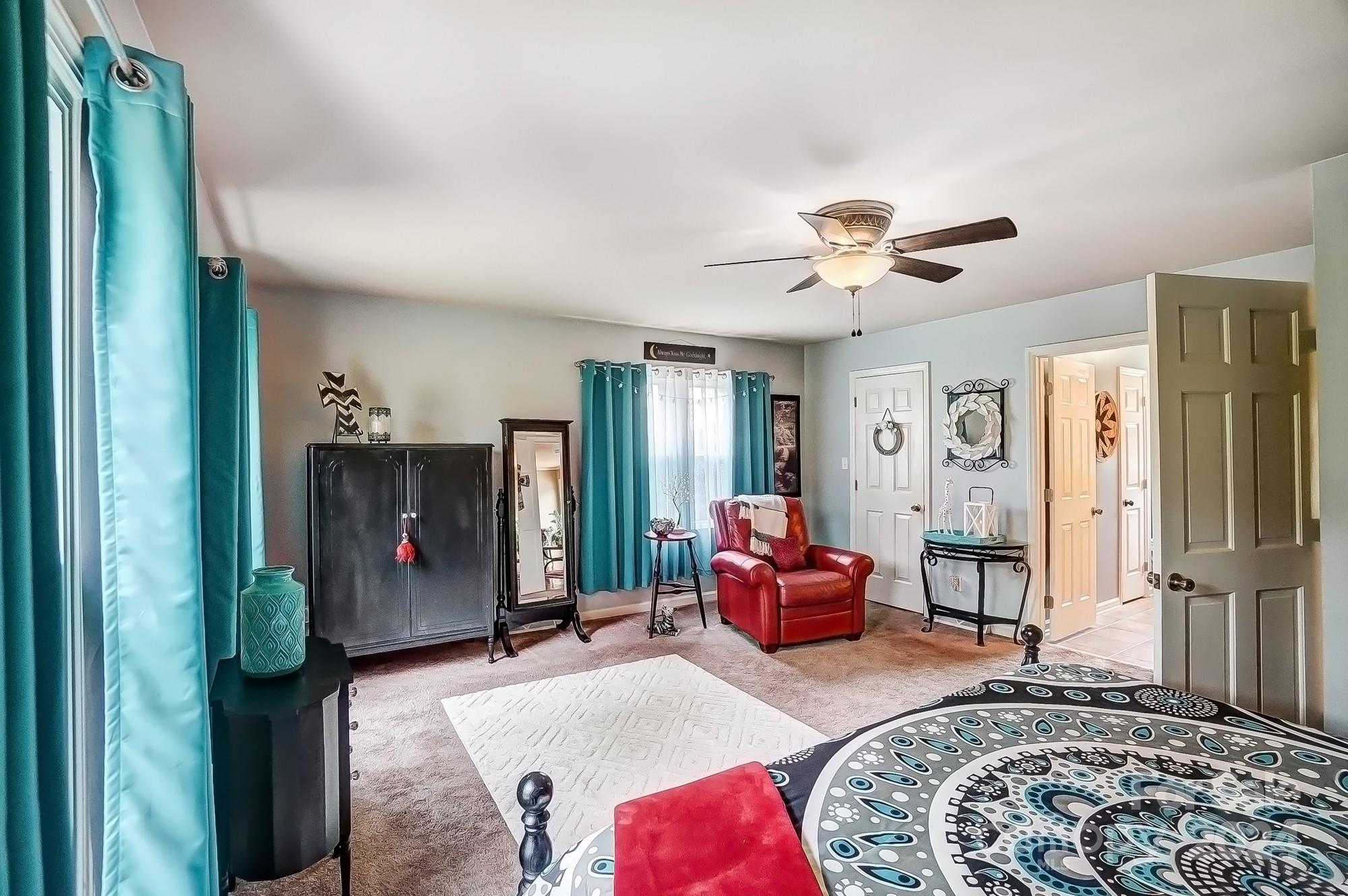 2803 Trinity Church Road Monroe, NC 28112 - Photo 24 of 48 a living room with furniture and a chandelier