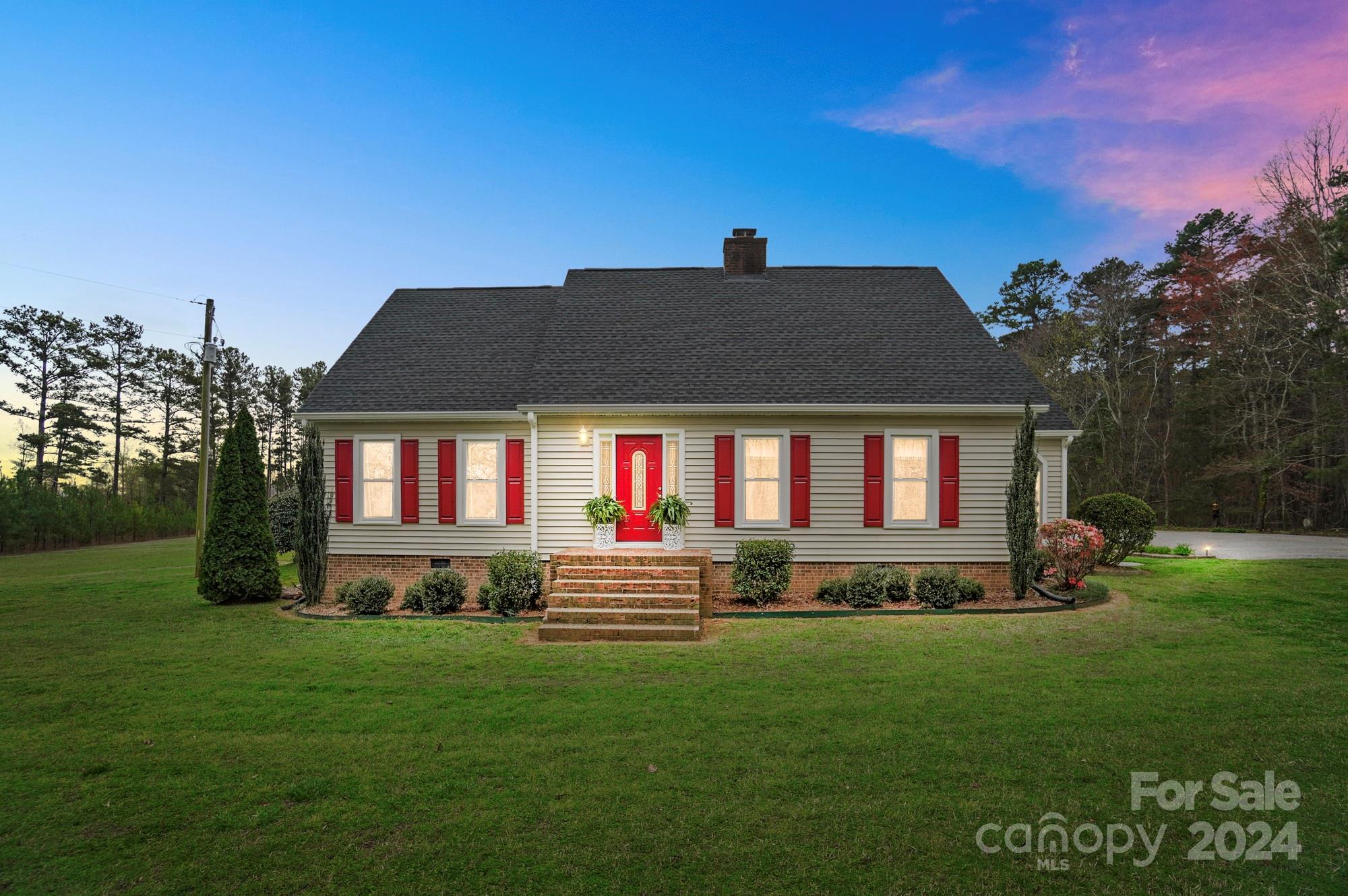 2803 Trinity Church Road Monroe, NC 28112 - Photo 28 of 48 a view of house with outdoor space and garden