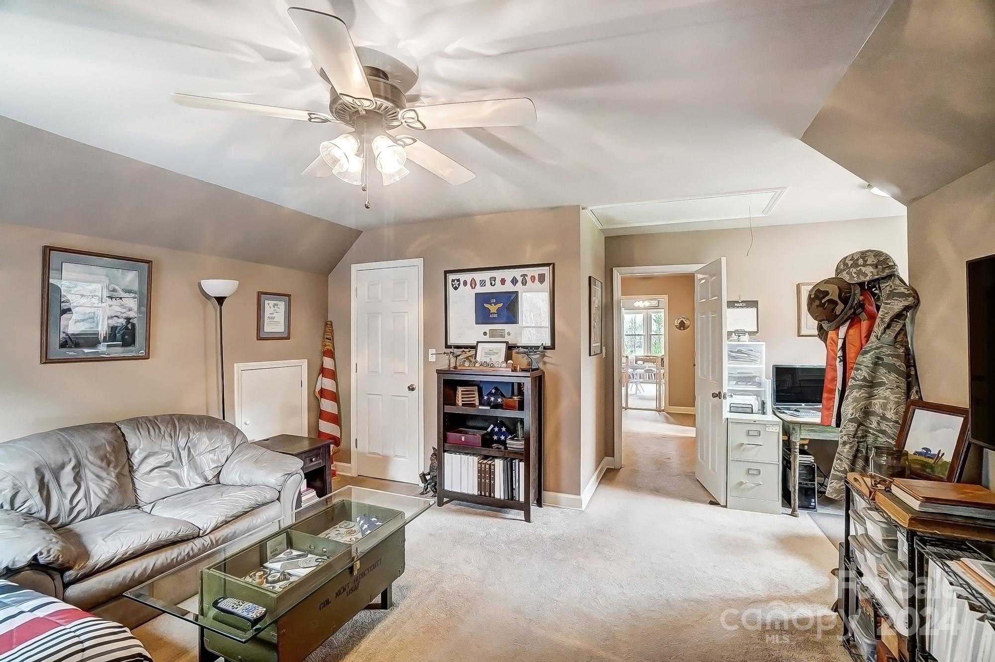 2803 Trinity Church Road Monroe, NC 28112 - Photo 29 of 48 a living room with furniture and a flat screen tv