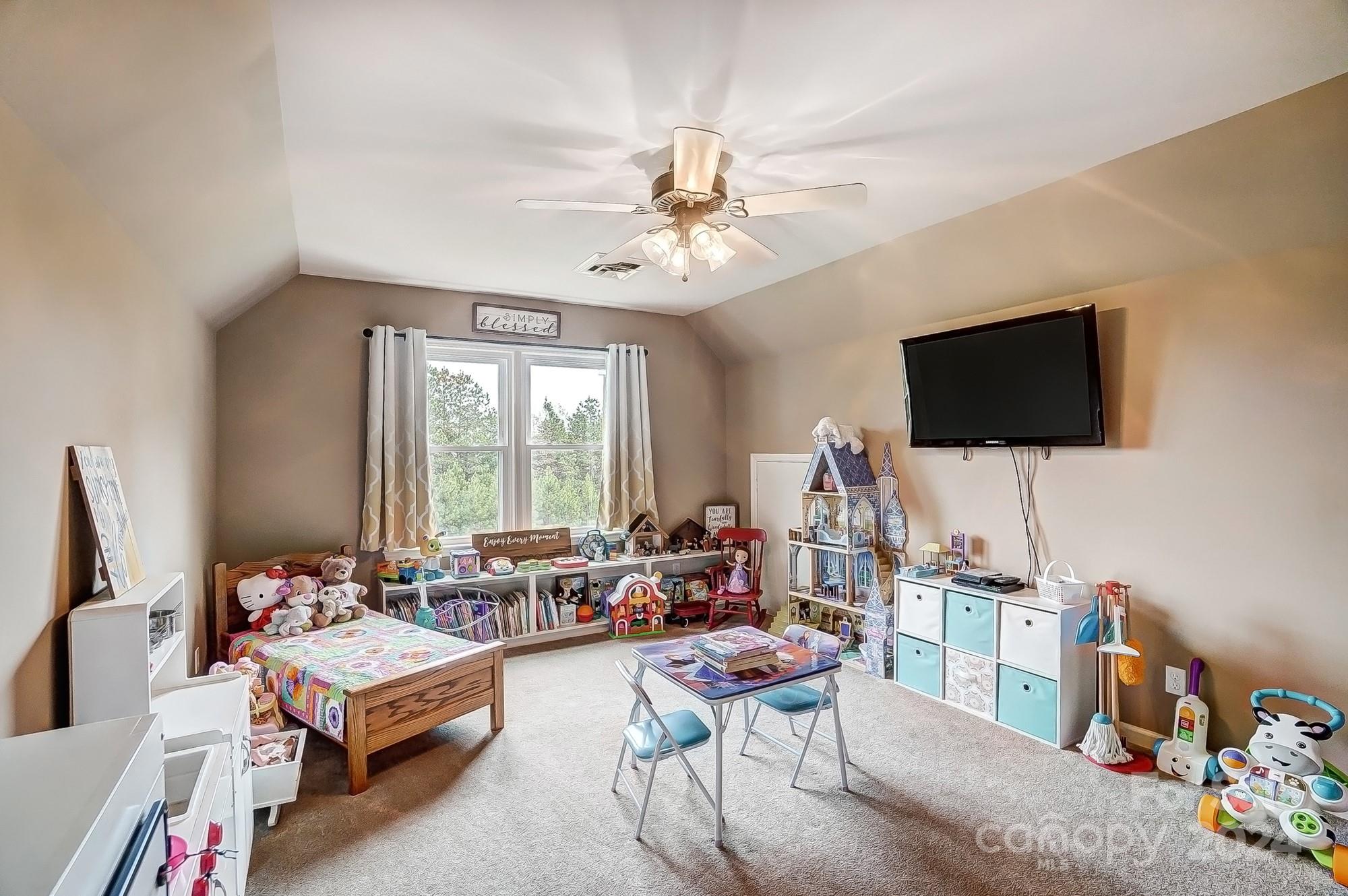 2803 Trinity Church Road Monroe, NC 28112 - Photo 33 of 48 a living room with furniture and a flat screen tv