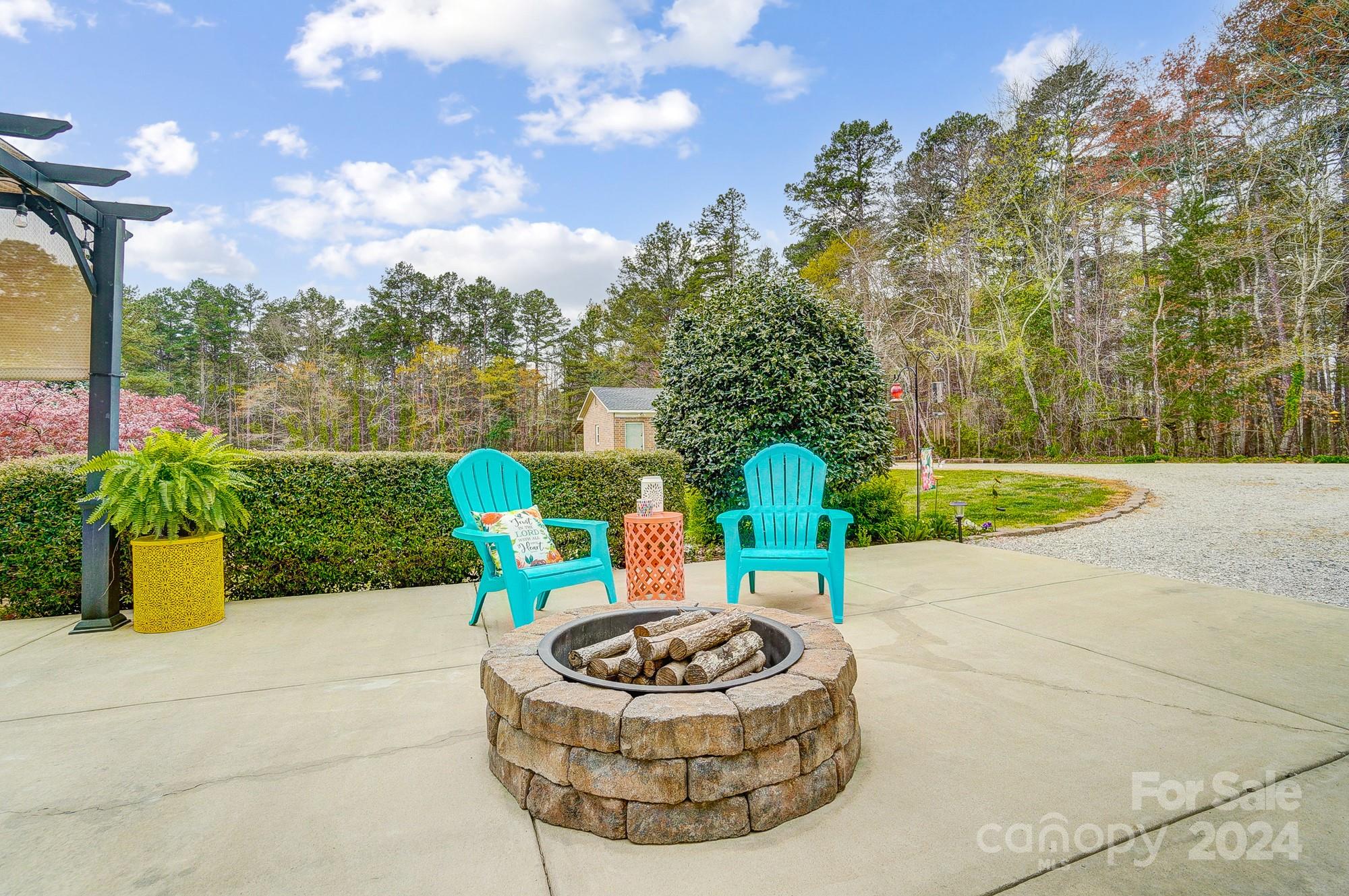 2803 Trinity Church Road Monroe, NC 28112 - Photo 36 of 48 a view of a chair and table in the garden