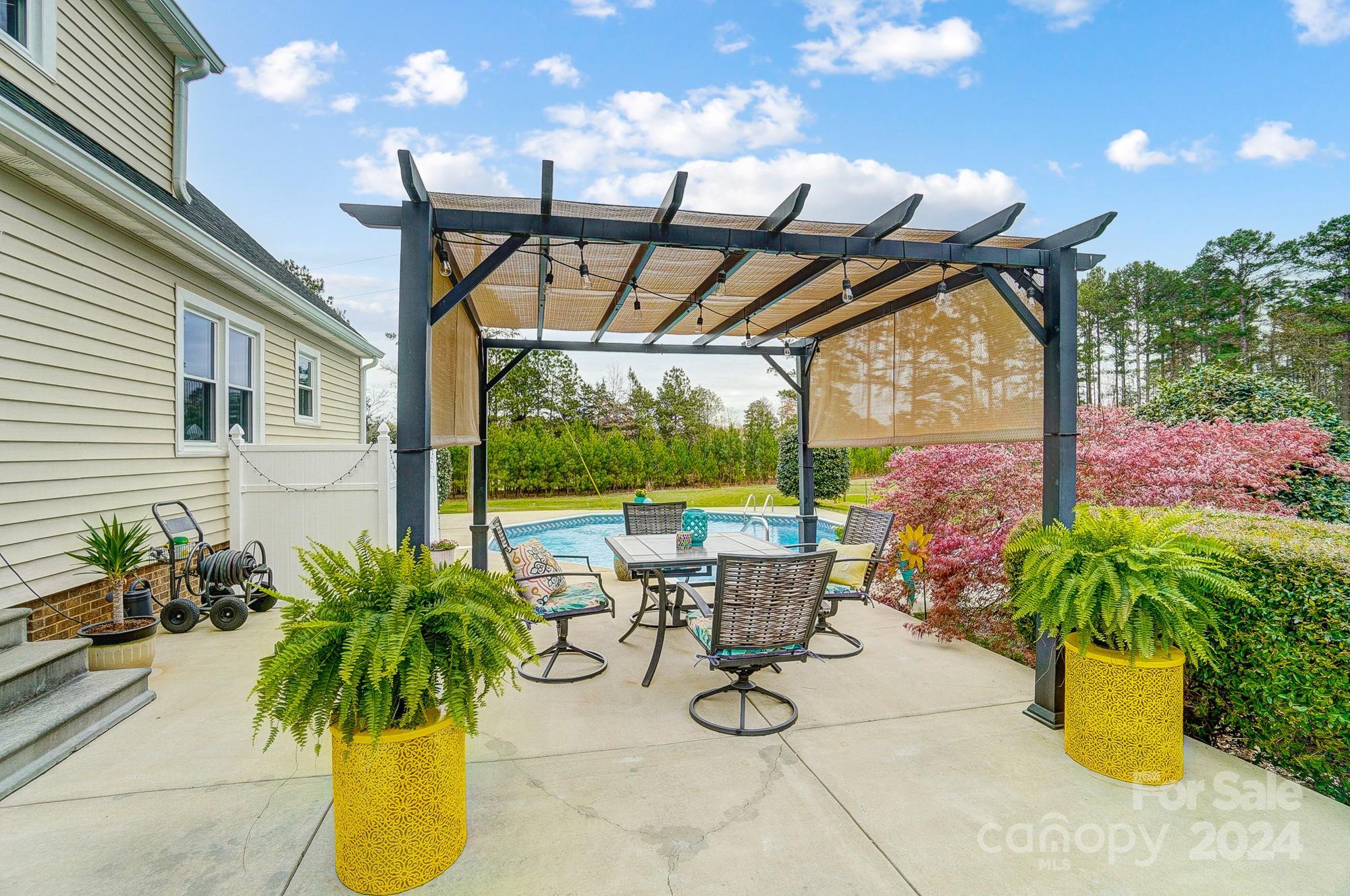 2803 Trinity Church Road Monroe, NC 28112 - Photo 38 of 48 a view of a swimming pool with potted plants
