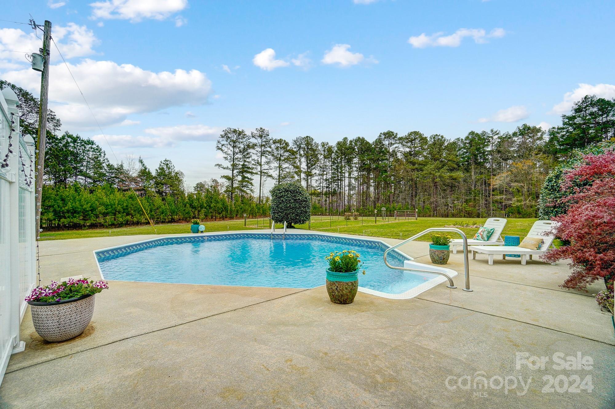 2803 Trinity Church Road Monroe, NC 28112 - Photo 39 of 48 a view of a swimming pool with a patio and yard