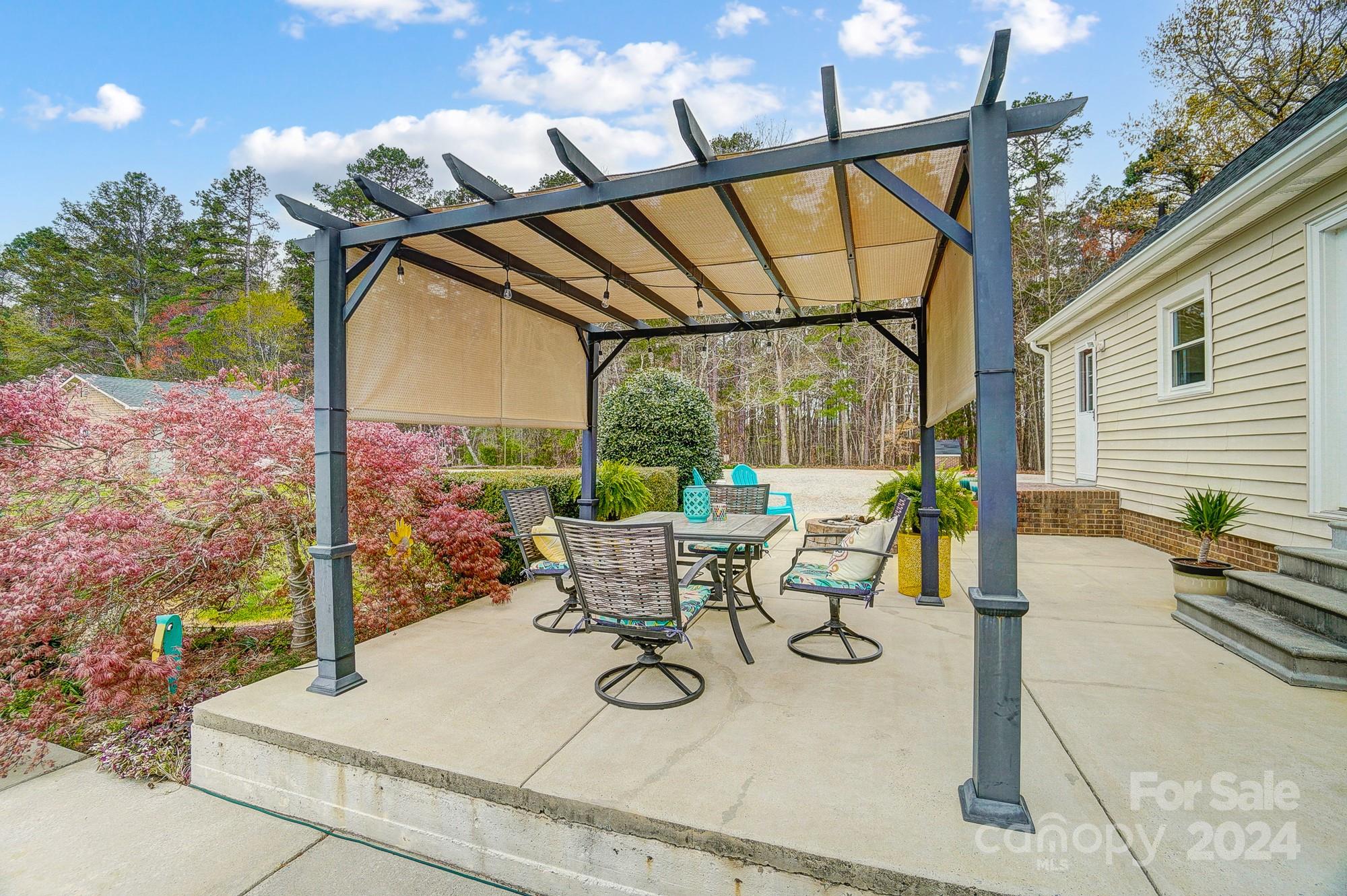 2803 Trinity Church Road Monroe, NC 28112 - Photo 40 of 48 a view of an chairs and tables in the patio