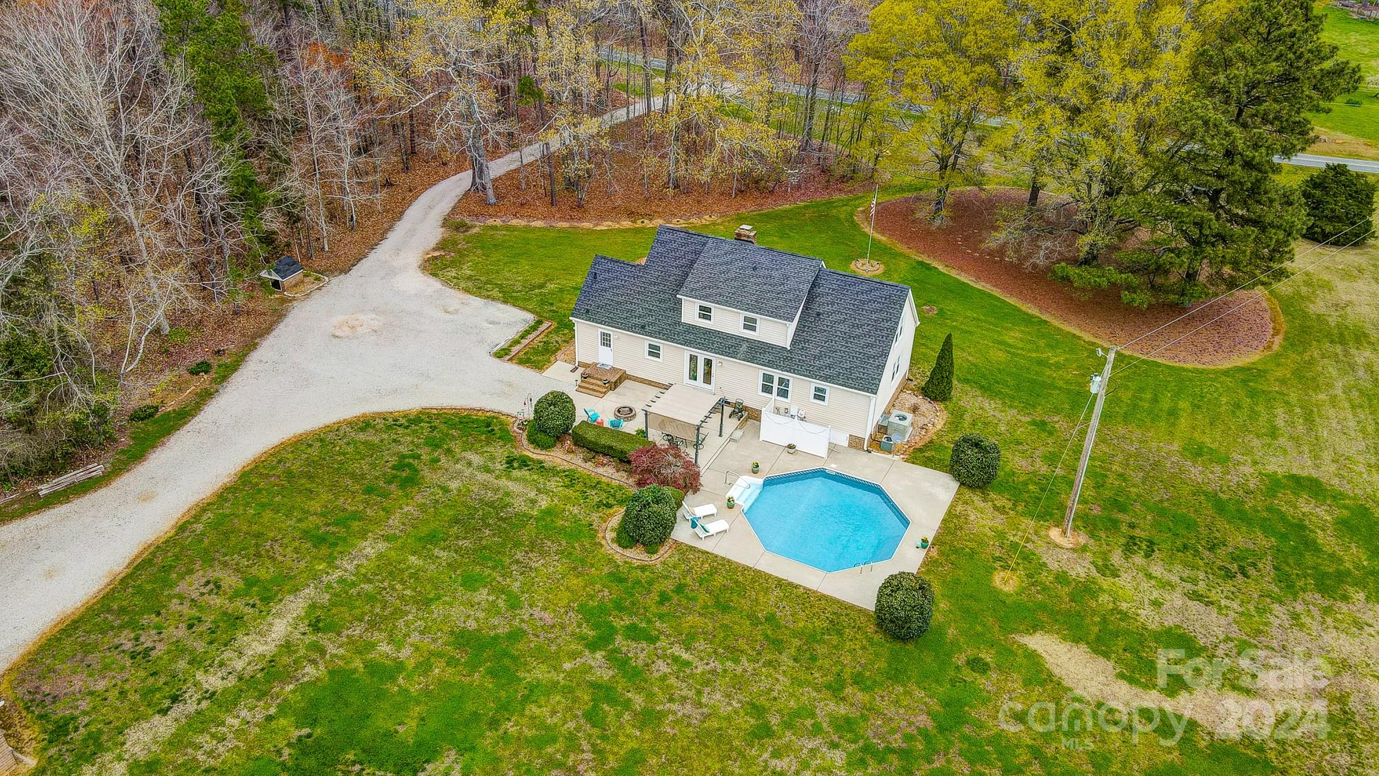 2803 Trinity Church Road Monroe, NC 28112 - Photo 4 of 48 an aerial view of a house with a swimming pool