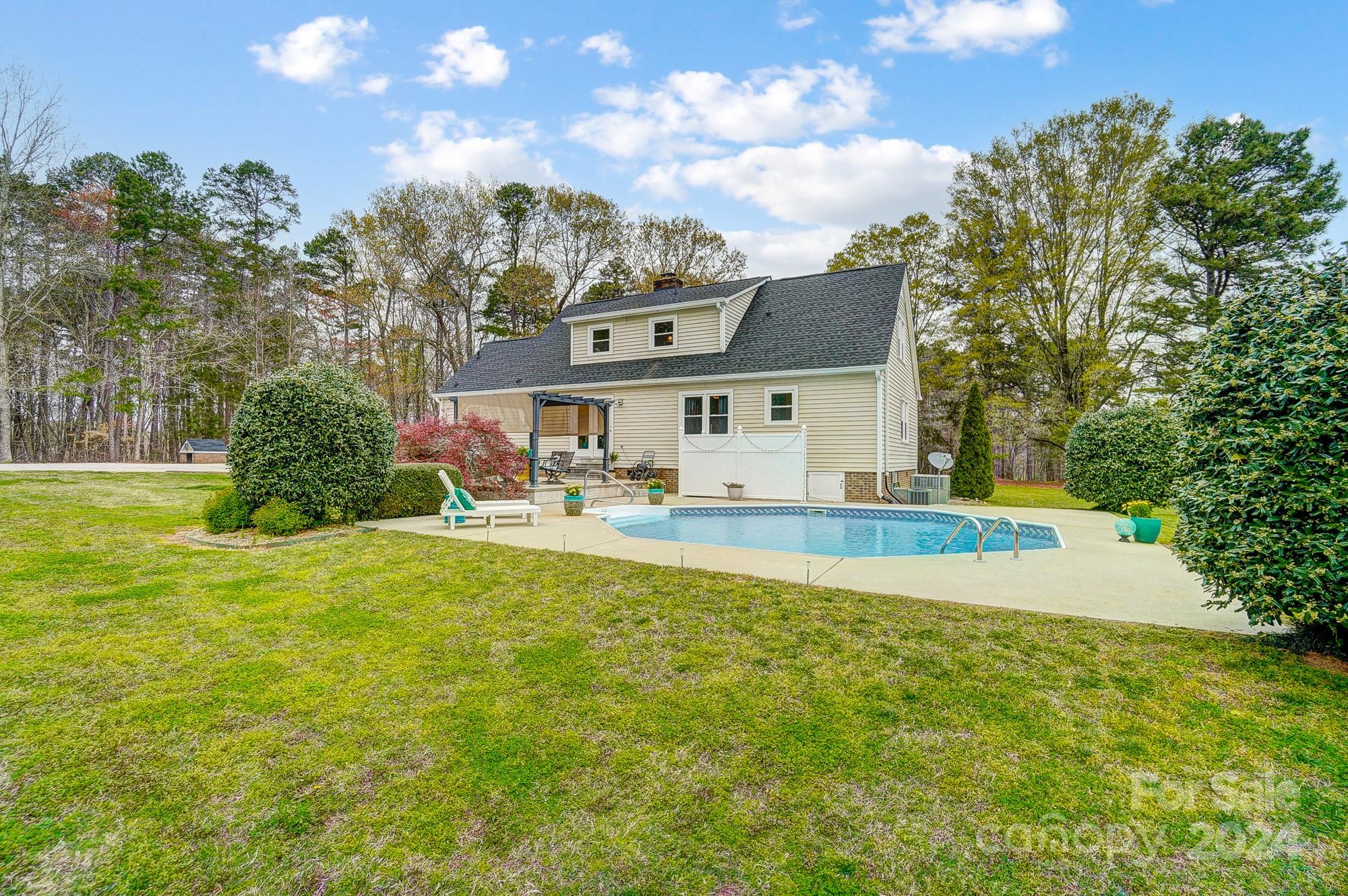 2803 Trinity Church Road Monroe, NC 28112 - Photo 42 of 48 a view of house with swimming pool