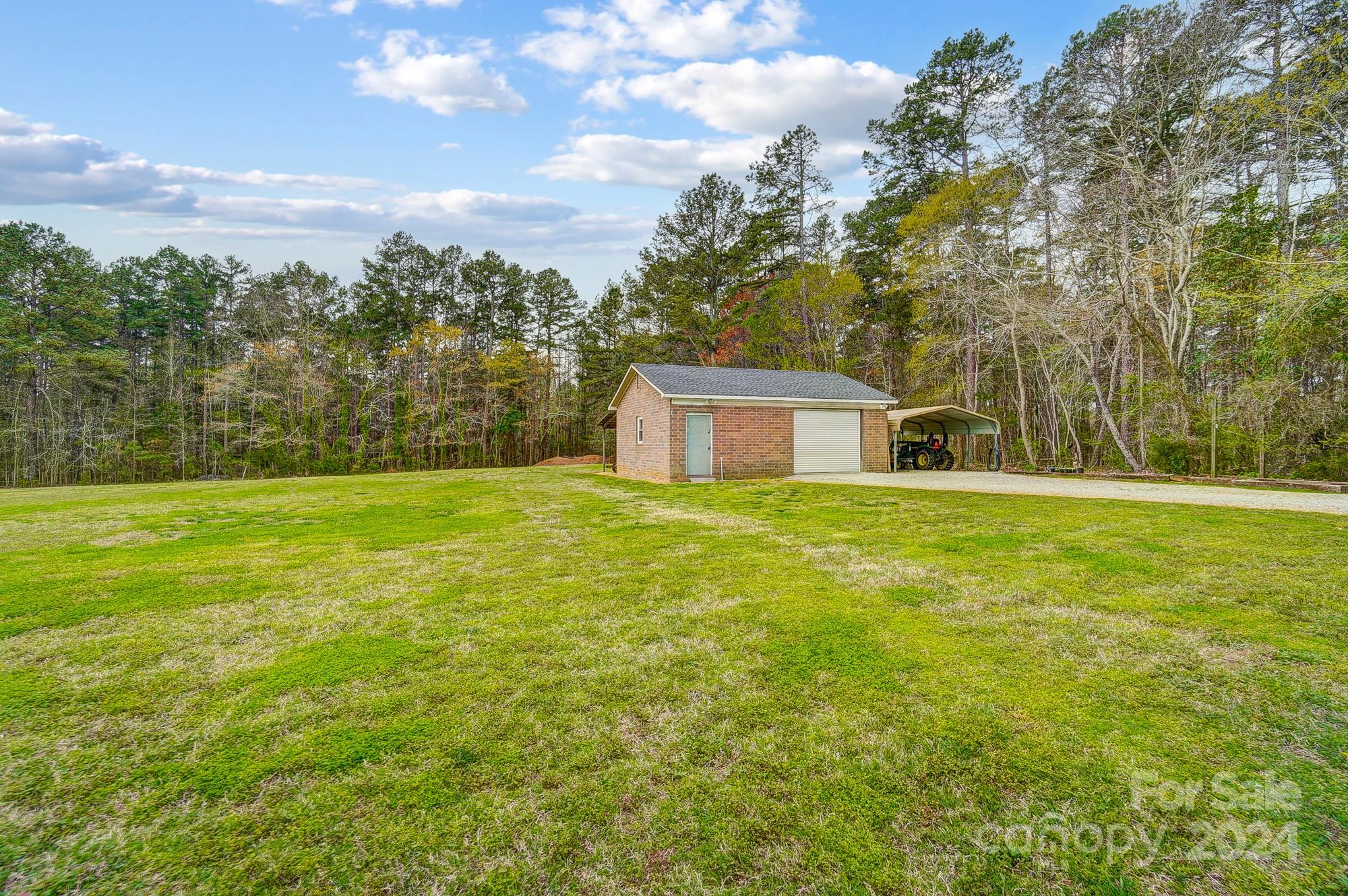 2803 Trinity Church Road Monroe, NC 28112 - Photo 46 of 48 a house view with swimming pool in front of it