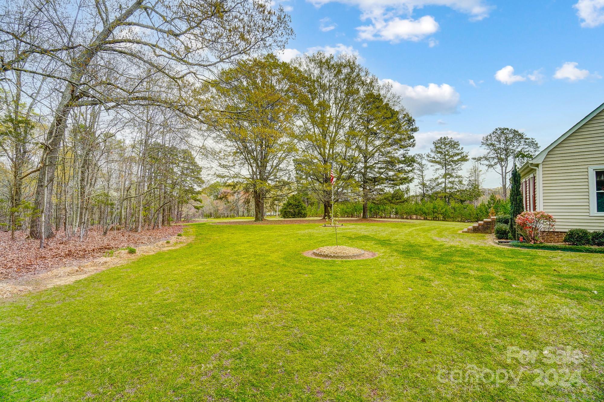 2803 Trinity Church Road Monroe, NC 28112 - Photo 48 of 48 a view of yard with swimming pool and green space