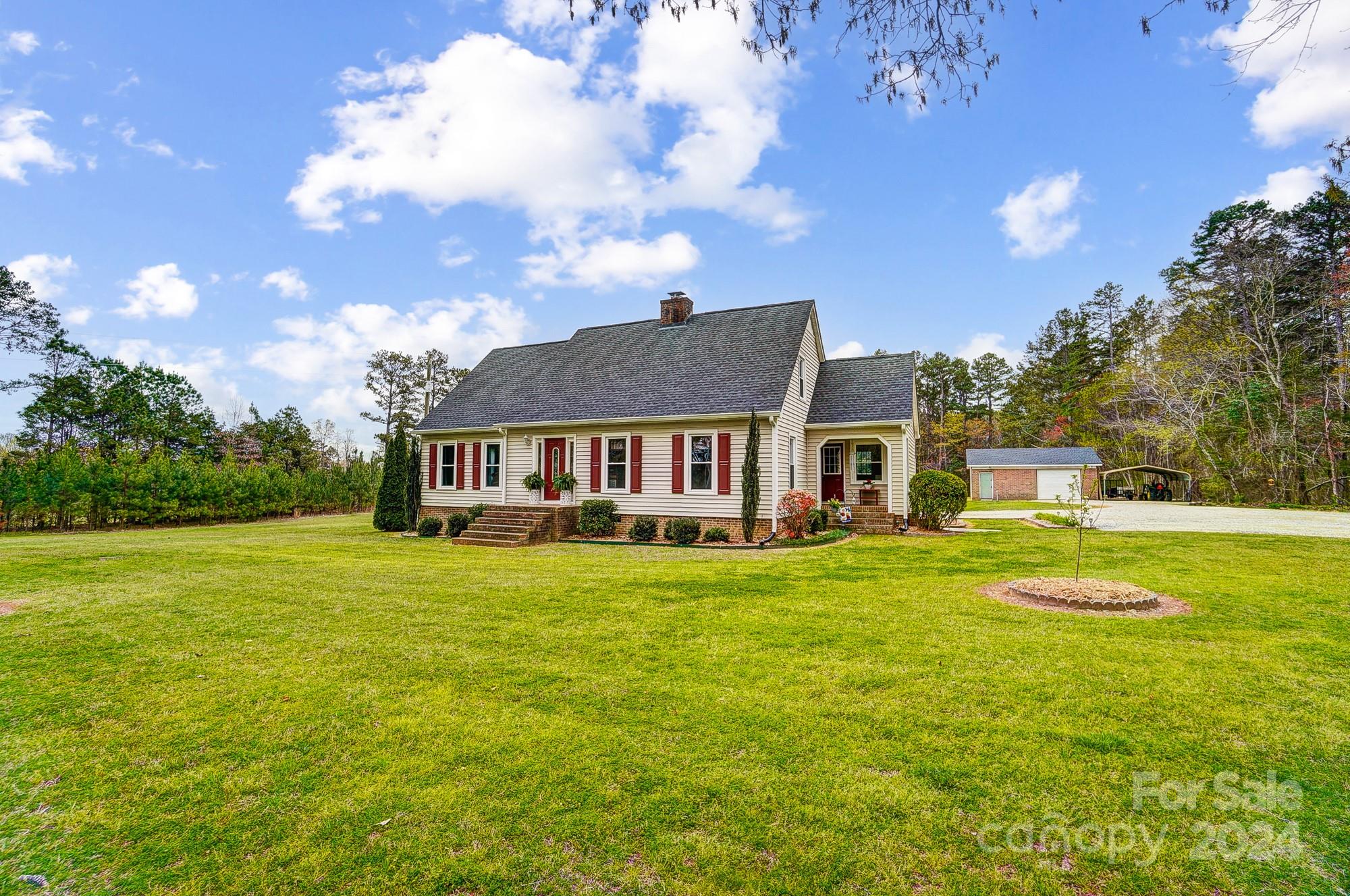 2803 Trinity Church Road Monroe, NC 28112 - Photo 5 of 48 a front view of a house with garden