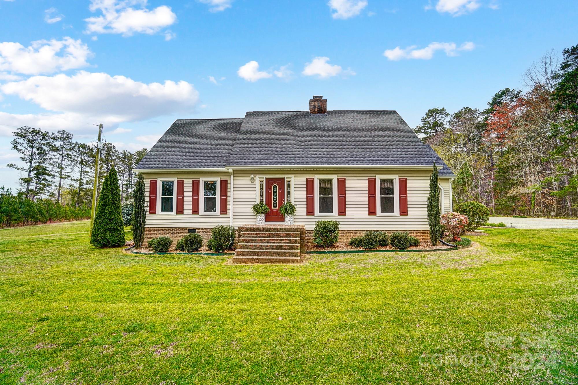 2803 Trinity Church Road Monroe, NC 28112 - Photo 7 of 48 a front view of a house with a yard
