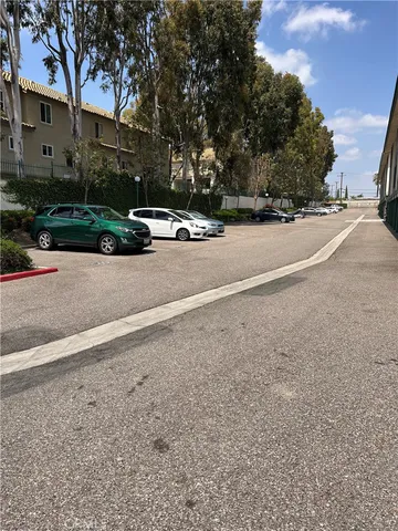 a view of street with parked cars