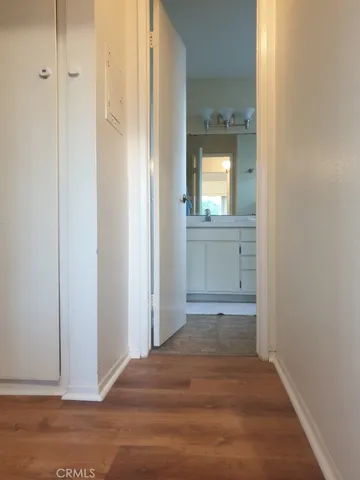 a view of a bathroom from a hallway