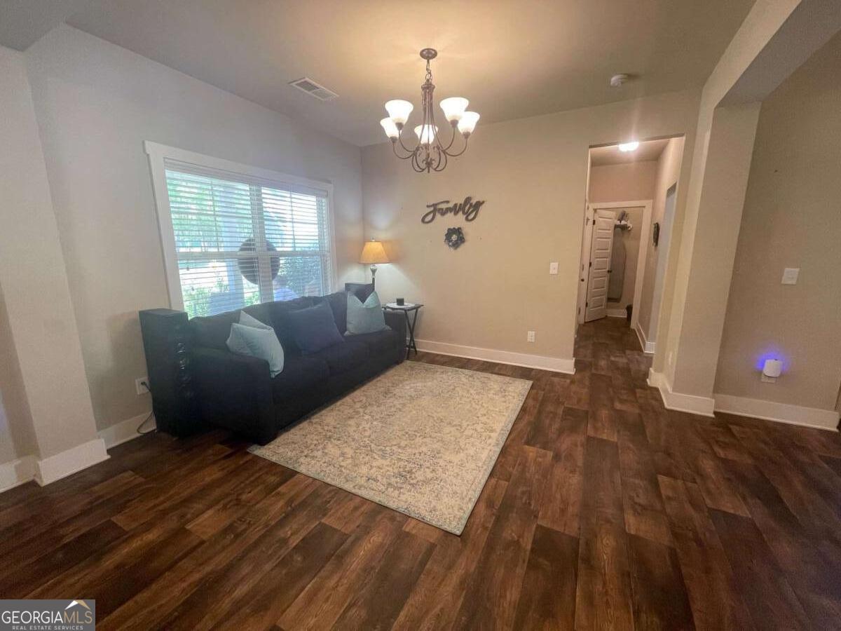 457 Old Good Hope Road Good Hope, GA 30641 - Photo 27 of 59 a living room with furniture and a chandelier