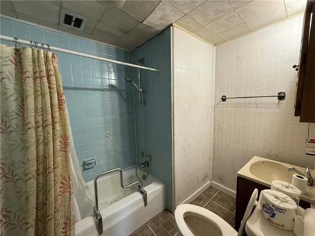 a bathroom with a sink and a shower