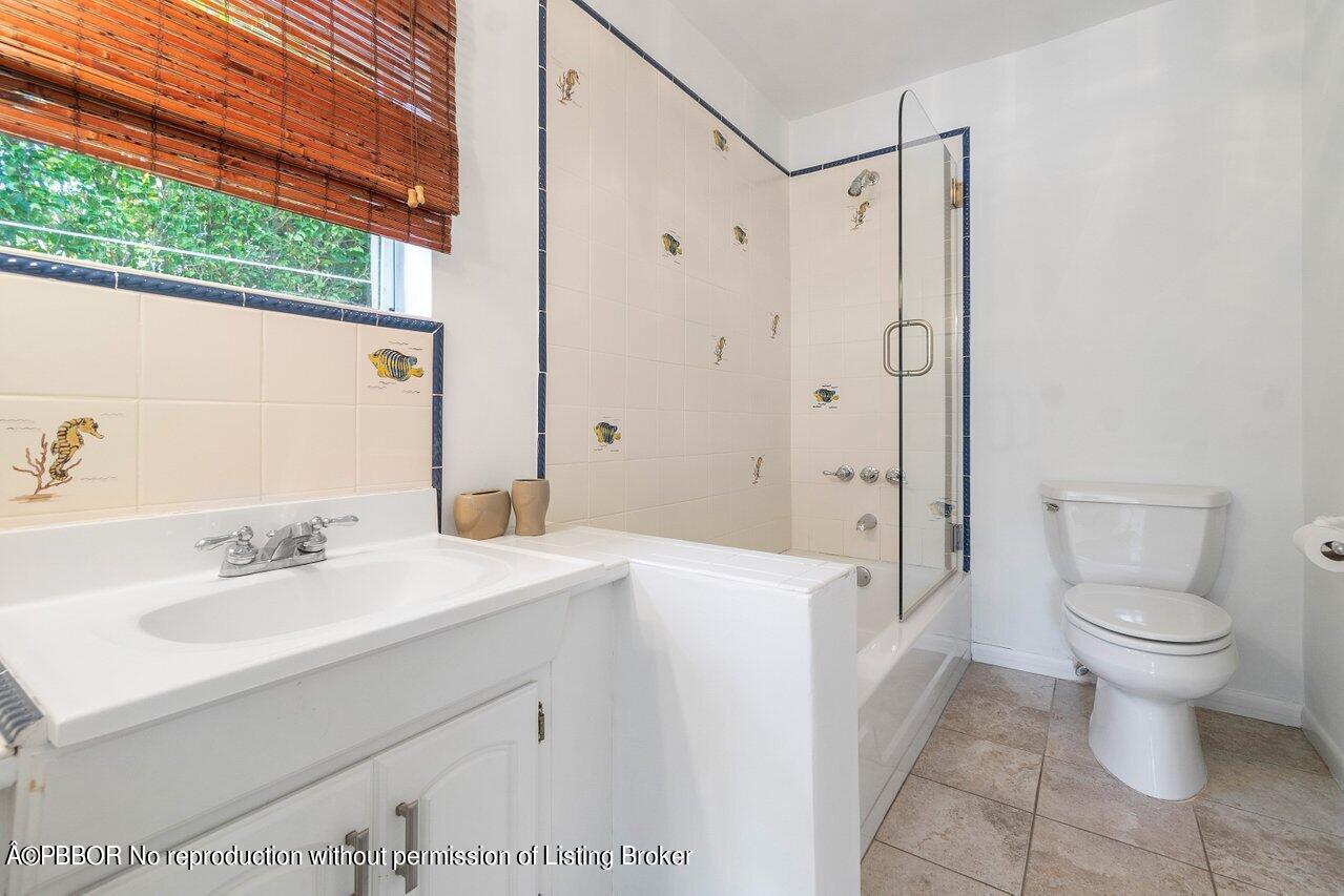 257 Fairview Road Palm Beach, FL 33480 - Photo 12 of 20 a bathroom with a sink toilet and shower