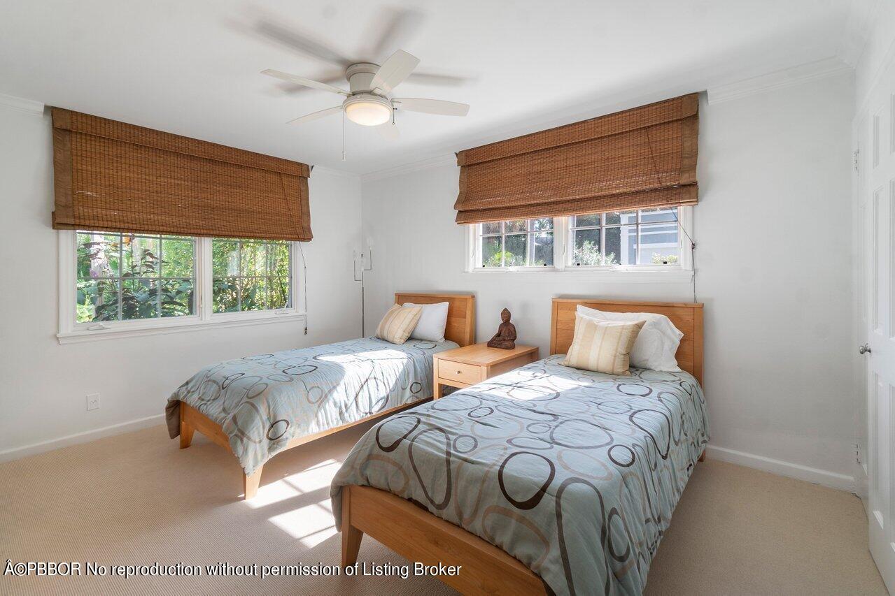 257 Fairview Road Palm Beach, FL 33480 - Photo 15 of 20 a bedroom with two beds and a large window