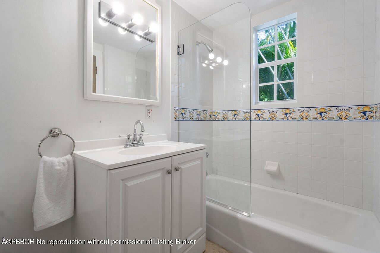 257 Fairview Road Palm Beach, FL 33480 - Photo 18 of 20 a bathroom with a sink and a mirror