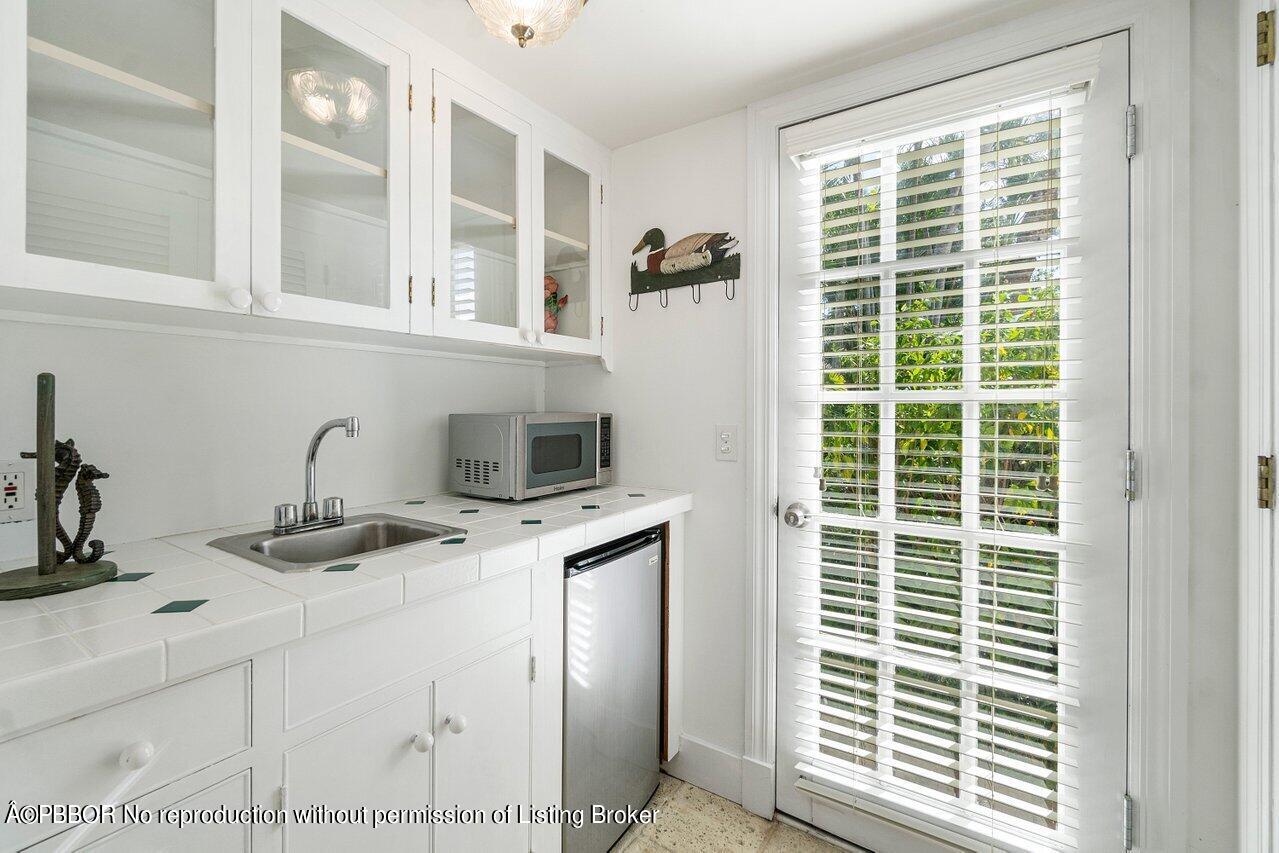 257 Fairview Road Palm Beach, FL 33480 - Photo 19 of 20 a kitchen with a window a sink and a window