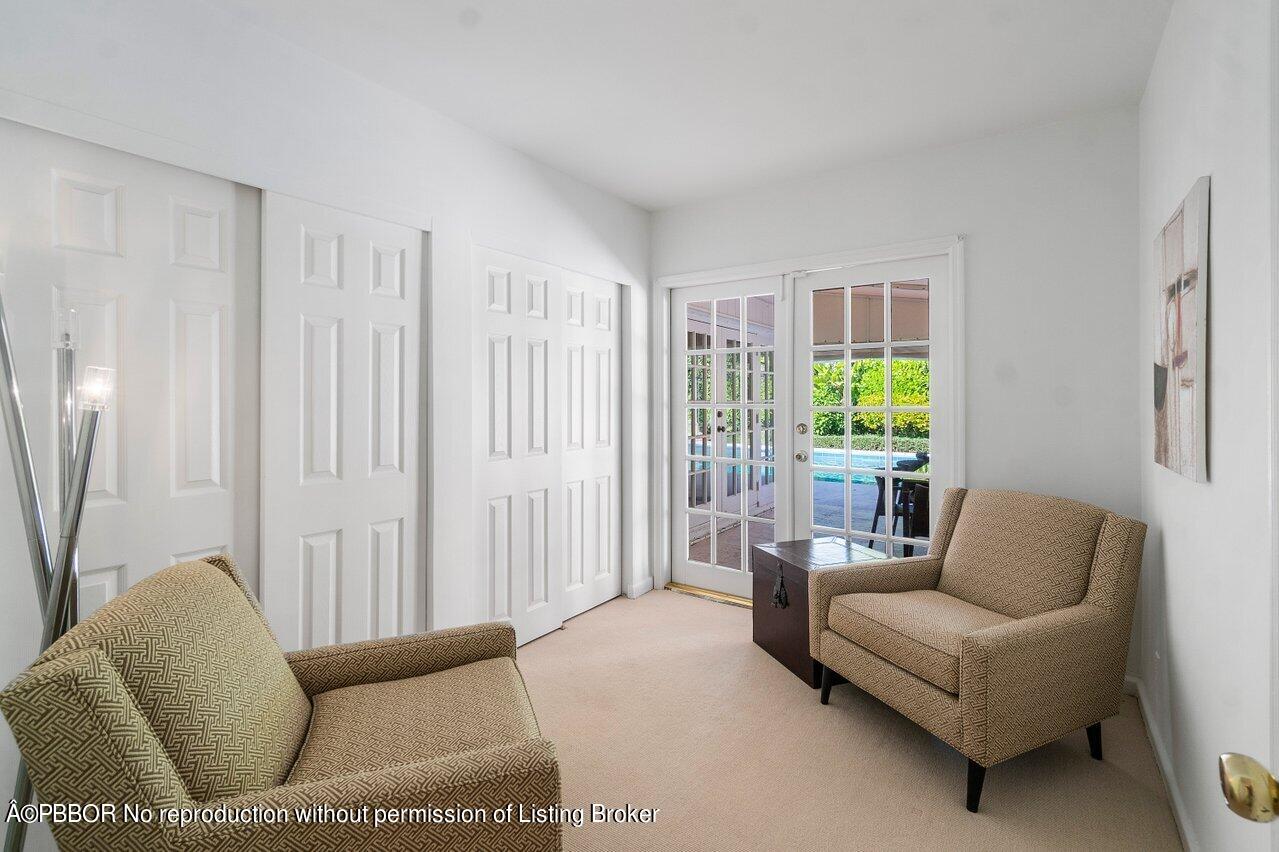 257 Fairview Road Palm Beach, FL 33480 - Photo 9 of 20 a living room with furniture and a large window