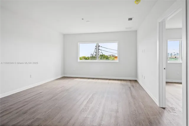 a view of an empty room and window