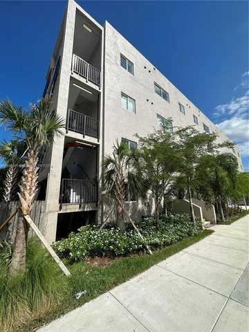 a front view of a building with garden