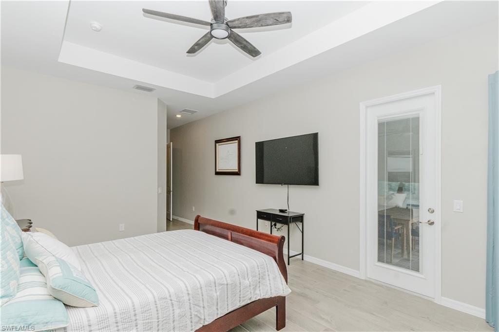 5439 Ternberry Road Ave Maria, FL 34142 - Photo 14 of 50 a bedroom with a bed and a flat screen tv