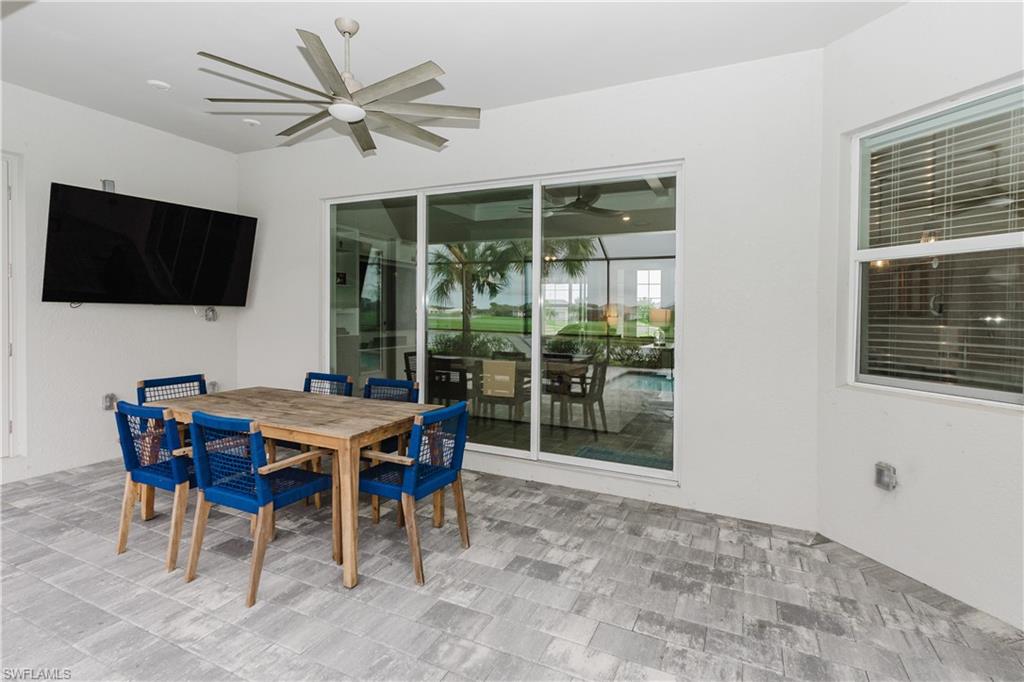 5439 Ternberry Road Ave Maria, FL 34142 - Photo 26 of 50 a view of a dining room with furniture window and outside view