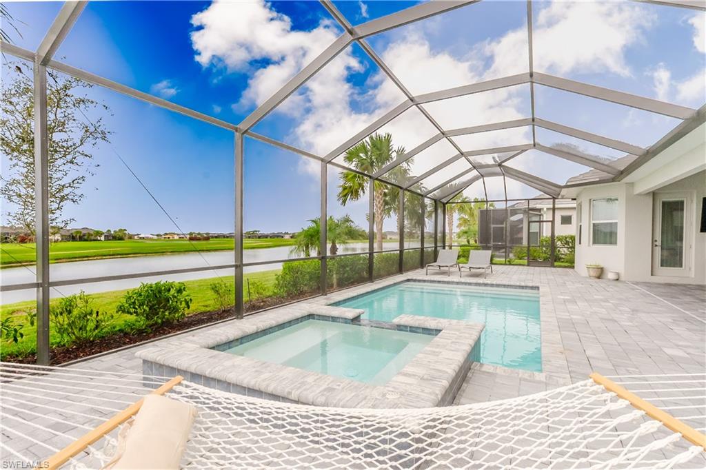 5439 Ternberry Road Ave Maria, FL 34142 - Photo 27 of 50 a view of swimming pool with a bench in patio
