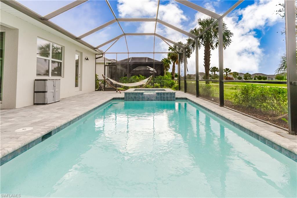 5439 Ternberry Road Ave Maria, FL 34142 - Photo 30 of 50 a view of a swimming pool with a porch