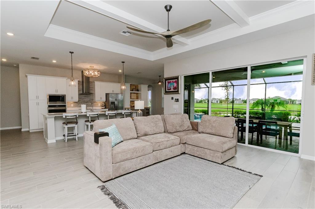 5439 Ternberry Road Ave Maria, FL 34142 - Photo 3 of 50 a living room with furniture and a large window