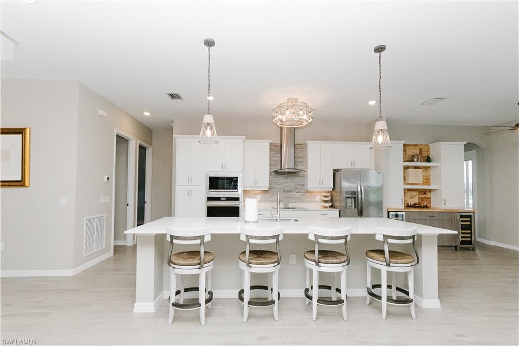 5439 Ternberry Road Ave Maria, FL 34142 - Photo 7 of 50 a view of a dining room with furniture