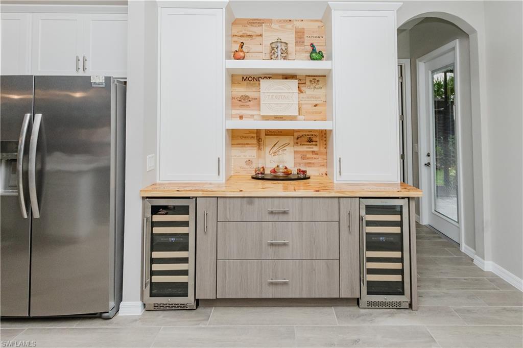 5439 Ternberry Road Ave Maria, FL 34142 - Photo 8 of 50 a kitchen with cabinets and appliances