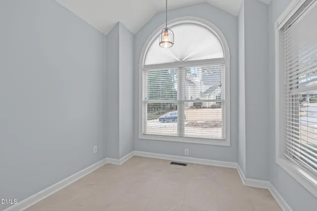 an empty room with a large window