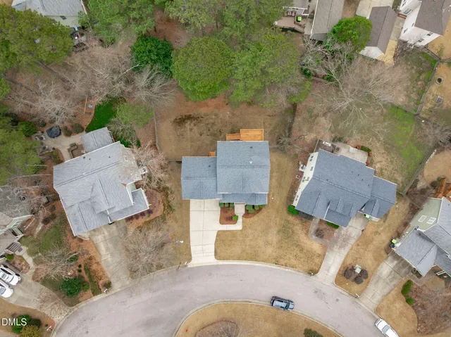 an aerial view of residential houses with outdoor space