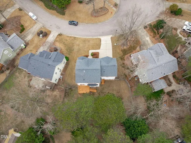 an aerial view of residential houses with outdoor space